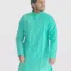 A man wearing an aqua blue or turquoise full-sleeve kurta with an all-over gold geometric print, perfect for Diwali