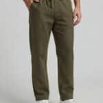 Loose fit comfortable olive green summer trousers for men, breathable beach pants, relaxed-fit eco-friendly linen bottoms, casual warm-weather loungewear.
