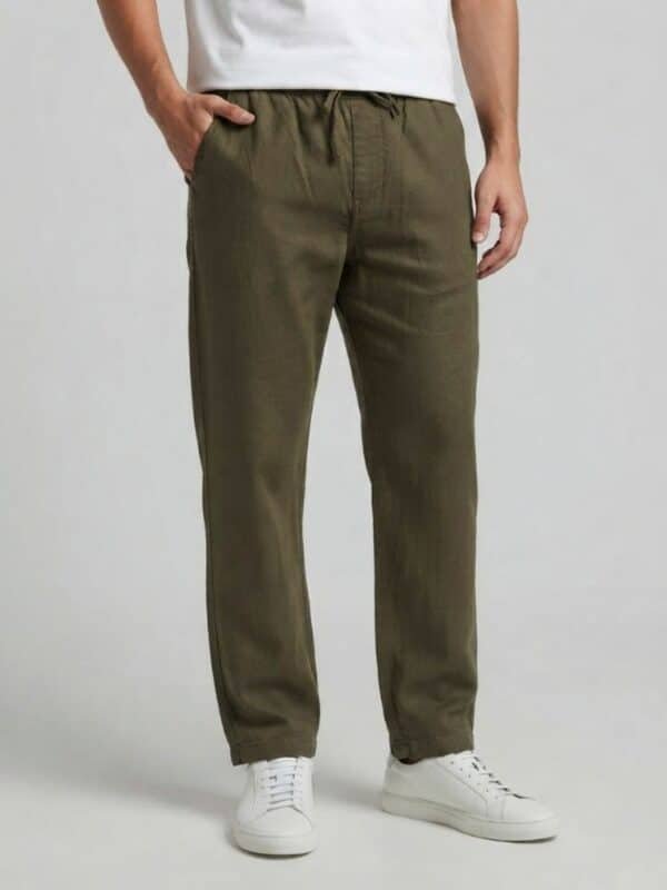Loose fit comfortable olive green summer trousers for men, breathable beach pants, relaxed-fit eco-friendly linen bottoms, casual warm-weather loungewear.